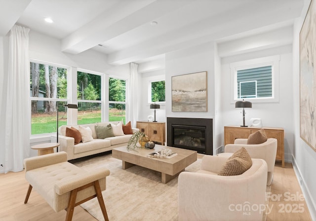 1912 St John St, Charlotte, NC 28216 - living room with light wood-type flooring, a glass covered fireplace, recessed lighting, and beamed ceiling