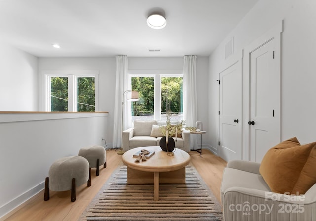 1912 St John St, Charlotte, NC 28216 - sitting room featuring light wood-style flooring and recessed lighting