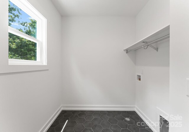 1912 St John St, Charlotte, NC 28216 - laundry area with dark tile patterned flooring and hookup for a washing machine