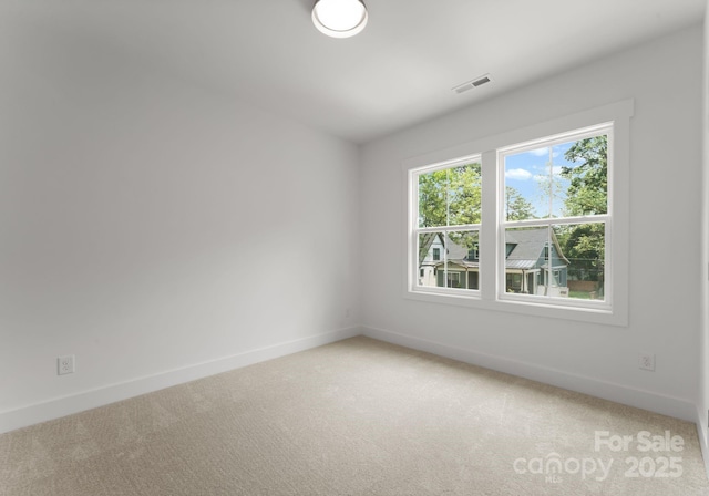1912 St John St, Charlotte, NC 28216 - unfurnished room with baseboards and light carpet