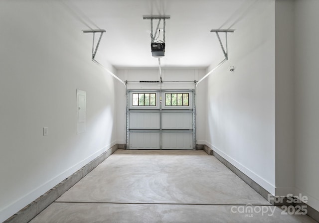 1912 St John St, Charlotte, NC 28216 - garage featuring a garage door opener and electric panel