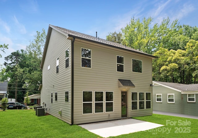 1912 St John St, Charlotte, NC 28216 - rear view of house with a patio area and a lawn