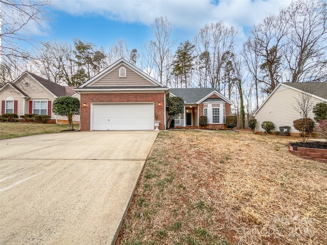 ranch-style home with a garage and a front lawn