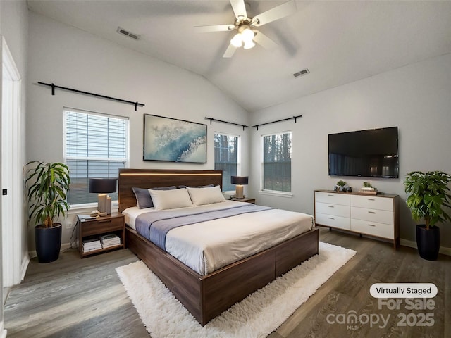 bedroom with lofted ceiling, hardwood / wood-style floors, and ceiling fan