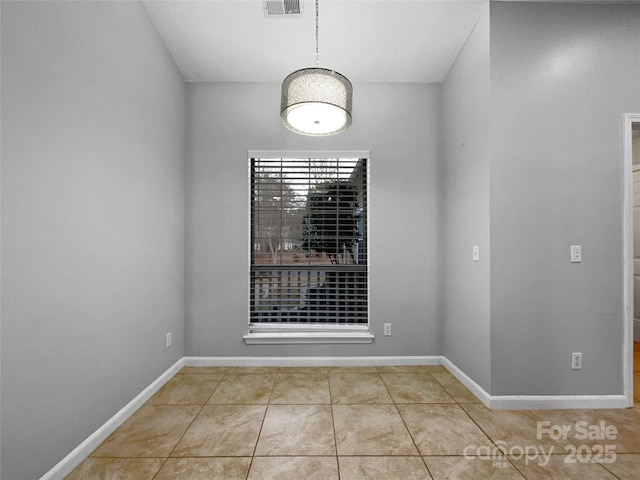 empty room featuring light tile patterned floors