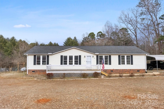 view of front of house featuring roof with shingles, crawl space, and a wooden deck