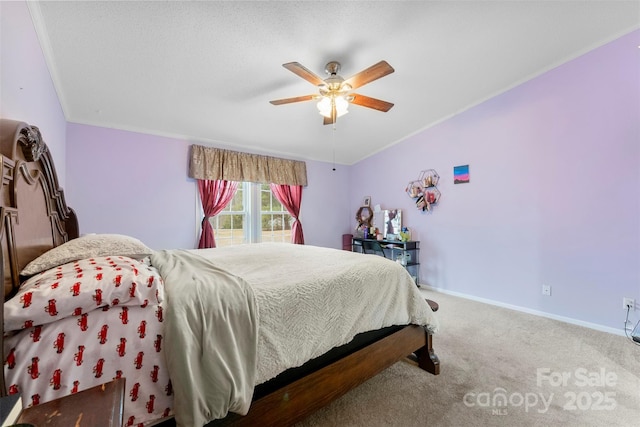 bedroom with carpet, baseboards, ceiling fan, and crown molding