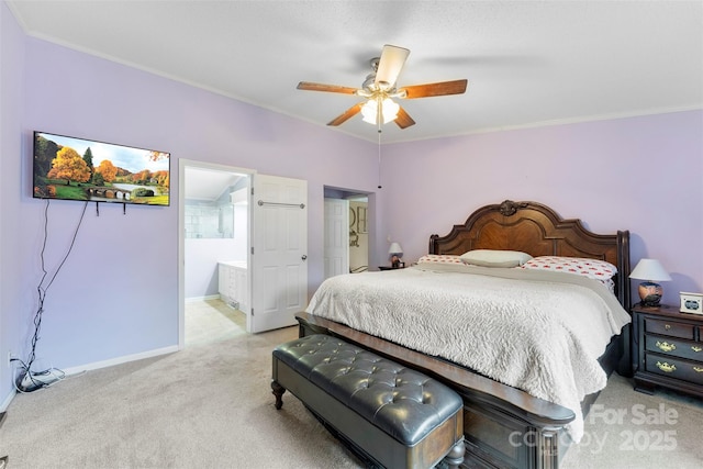 bedroom featuring connected bathroom, a ceiling fan, baseboards, ornamental molding, and carpet