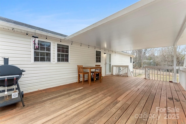 wooden terrace featuring grilling area