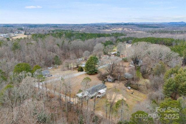 aerial view featuring a view of trees