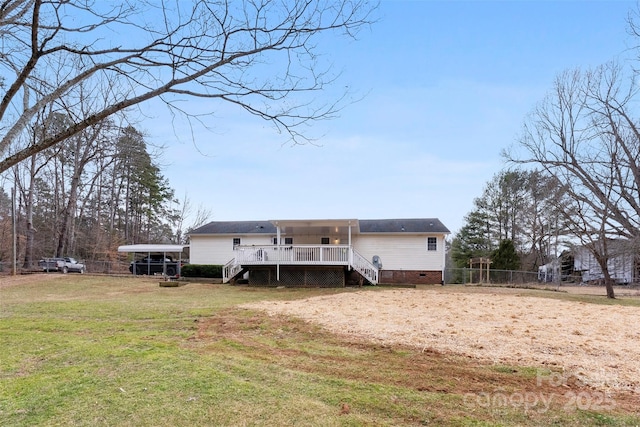 back of property with a lawn, crawl space, stairs, fence, and a deck