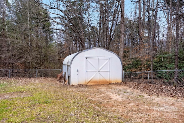 view of shed featuring a fenced backyard