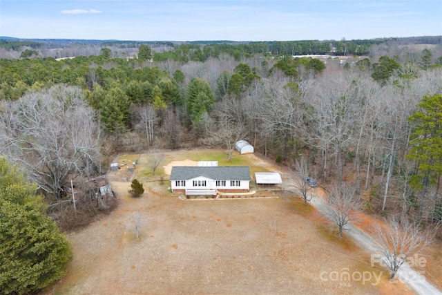 drone / aerial view with a view of trees