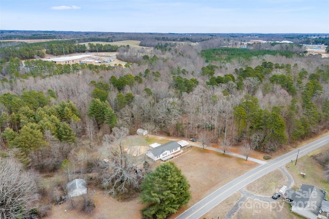 aerial view featuring a view of trees