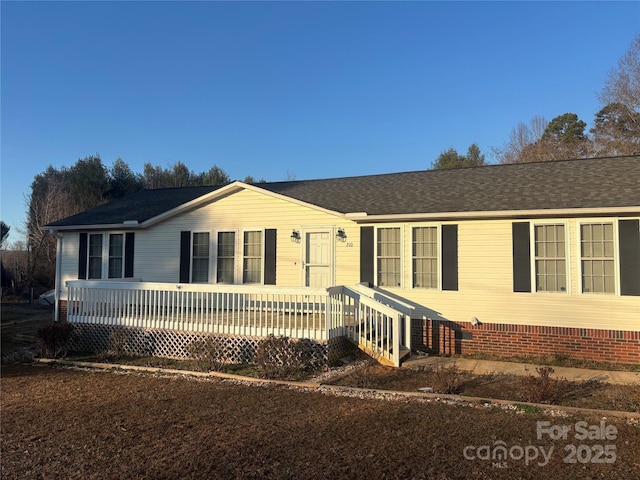 view of front of property featuring a deck