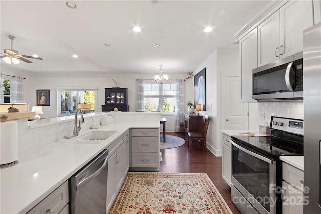 kitchen featuring sink, backsplash, plenty of natural light, and stainless steel appliances