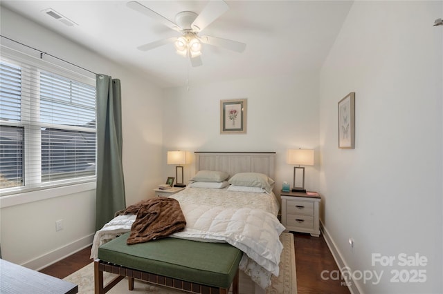 bedroom with dark wood-type flooring and ceiling fan