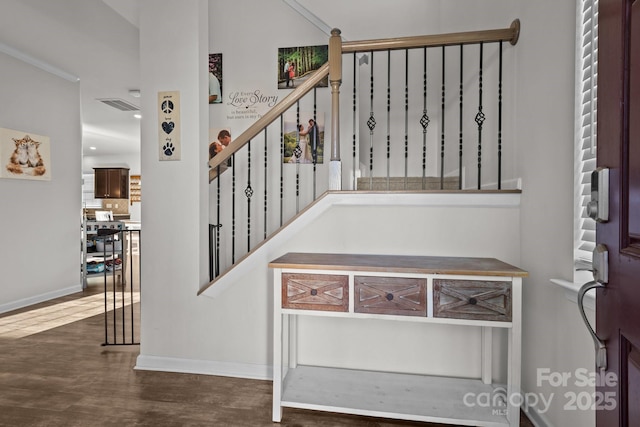 stairs featuring wood-type flooring