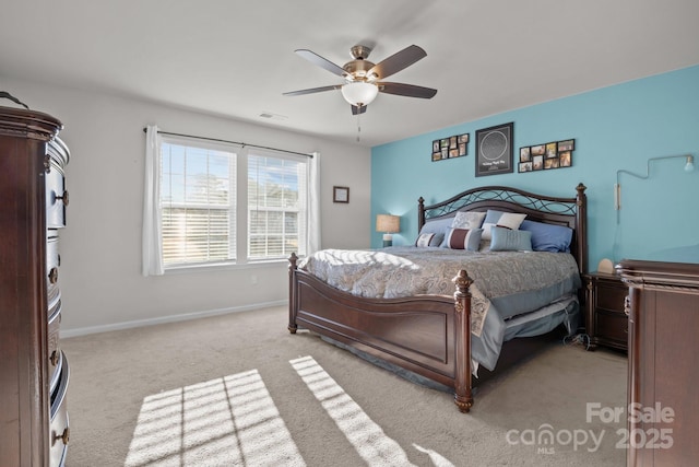 bedroom with light colored carpet and ceiling fan