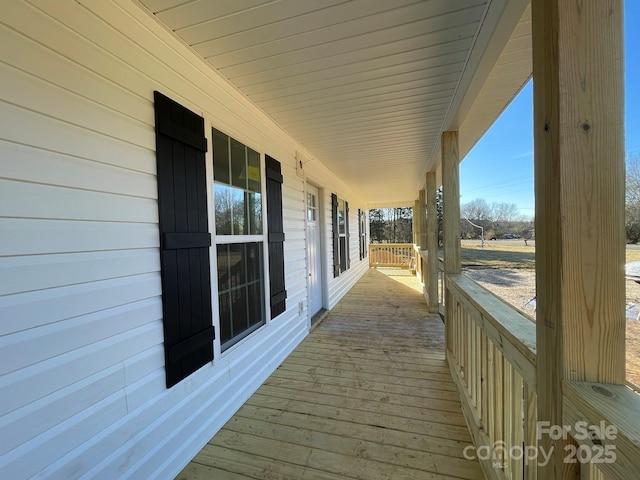 wooden deck featuring covered porch