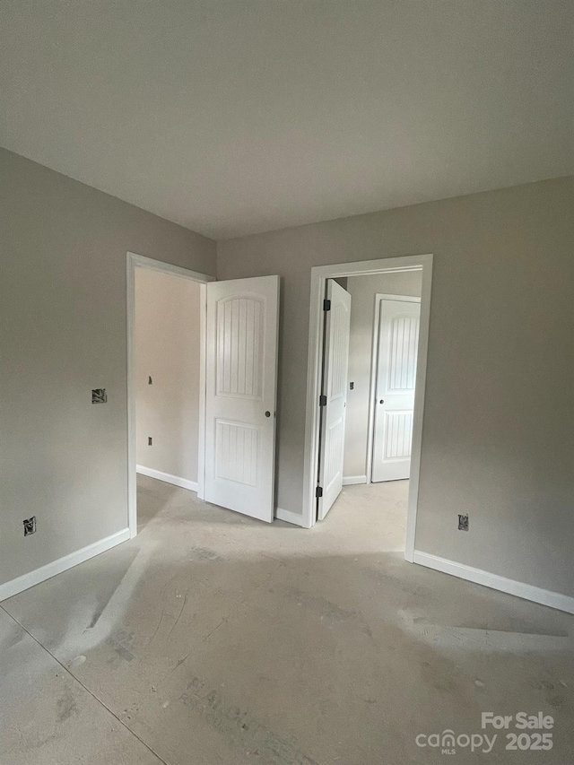 unfurnished bedroom with baseboards