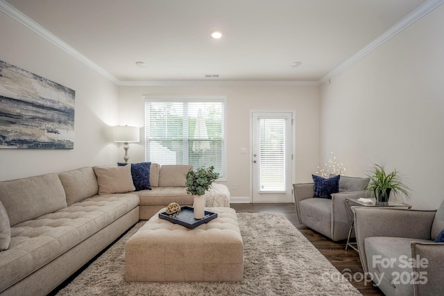 living room with crown molding and dark wood-type flooring