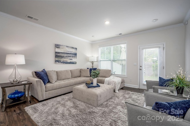 living room with ornamental molding and dark hardwood / wood-style floors