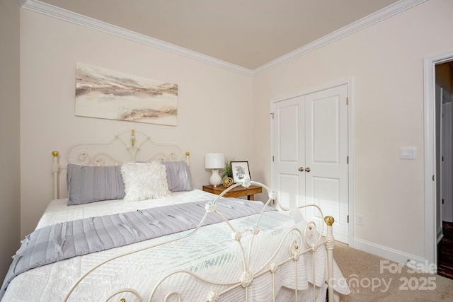 bedroom with crown molding, carpet, and a closet