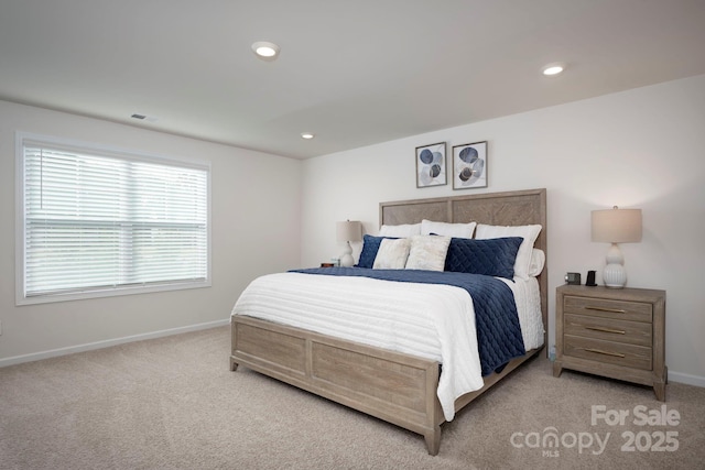 bedroom featuring light colored carpet