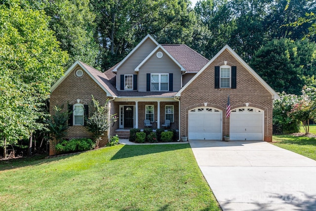 front of property featuring a garage, a front yard, and a porch