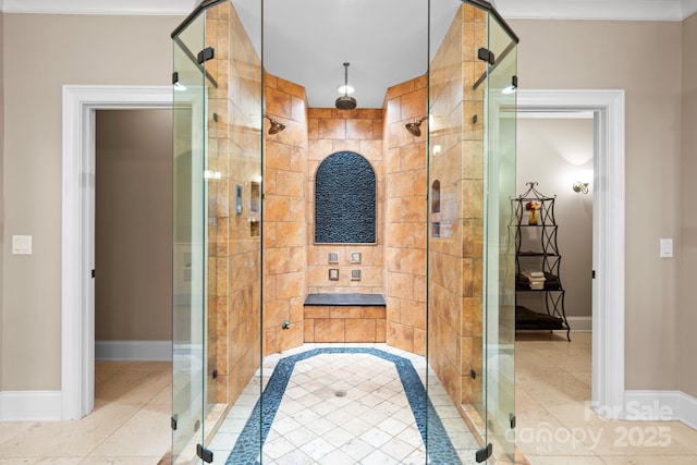 bathroom with tile patterned flooring, a shower stall, and baseboards