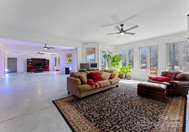 living room featuring concrete floors and ceiling fan