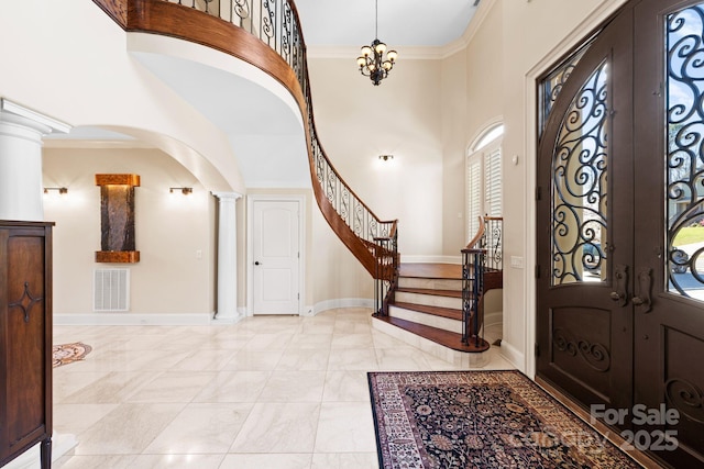 entryway with stairway, french doors, visible vents, and ornamental molding