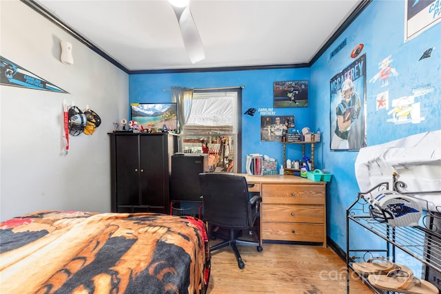 bedroom with crown molding and light wood-type flooring