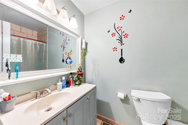 bathroom with vanity and toilet