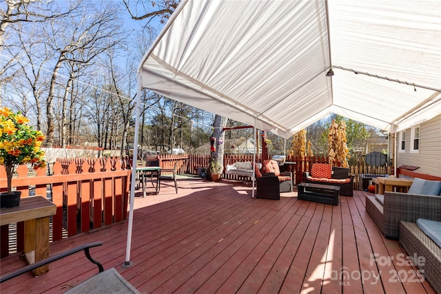 wooden deck with an outdoor living space