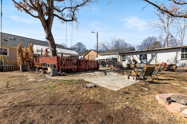 view of yard with a deck and a patio area