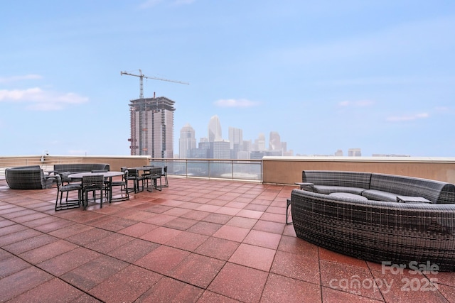 view of patio featuring an outdoor living space and a city view