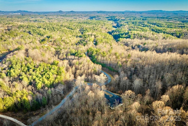 drone / aerial view with a view of trees