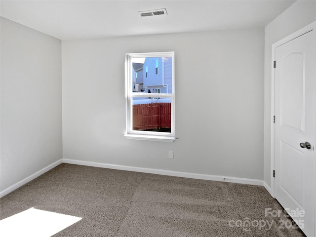 unfurnished room featuring carpet flooring