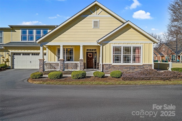 view of front facade featuring a garage and covered porch