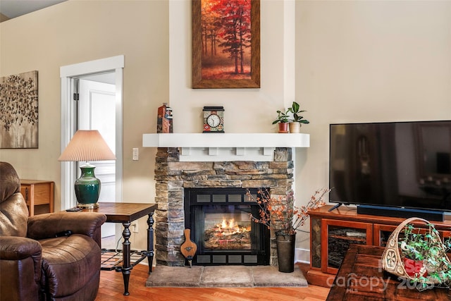 sitting room with hardwood / wood-style floors and a fireplace