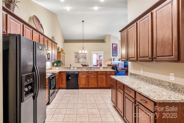 kitchen featuring sink, light tile patterned floors, black appliances, decorative light fixtures, and a chandelier