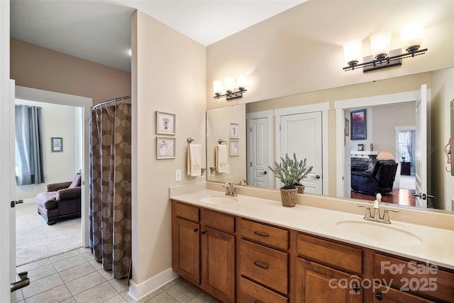 bathroom with tile patterned flooring and vanity