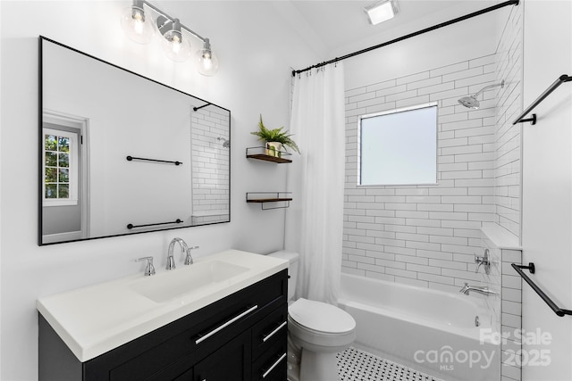 full bathroom with vanity, shower / bath combination with curtain, and toilet