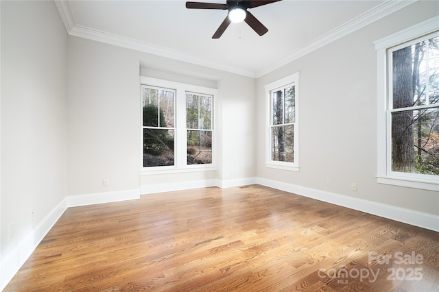 spare room featuring ornamental molding, light hardwood / wood-style floors, and ceiling fan