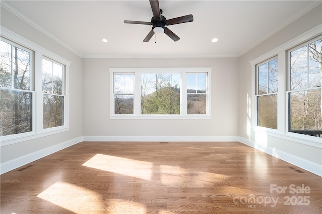 unfurnished sunroom with ceiling fan and plenty of natural light