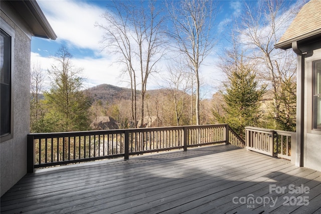 wooden terrace with a mountain view