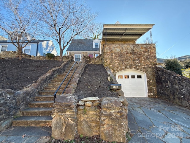 view of property exterior with a garage