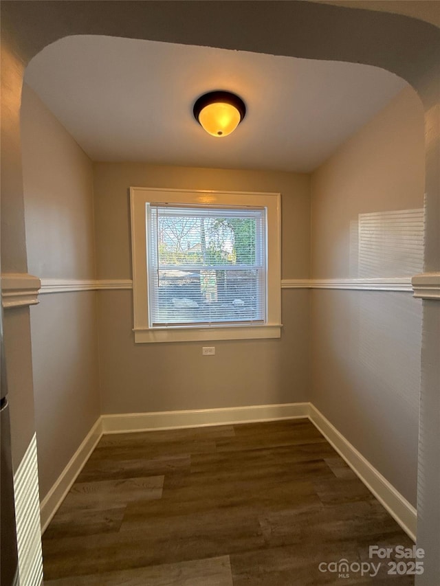 empty room featuring dark wood-type flooring